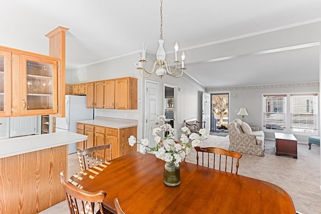 dining room with crown molding and an inviting chandelier