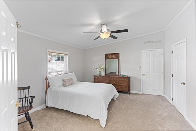 bedroom featuring ceiling fan, ornamental molding, vaulted ceiling, and light carpet