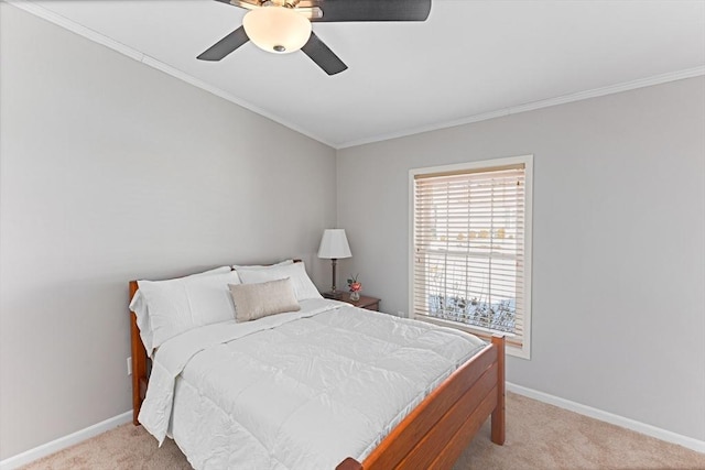 bedroom featuring light carpet, ornamental molding, and ceiling fan