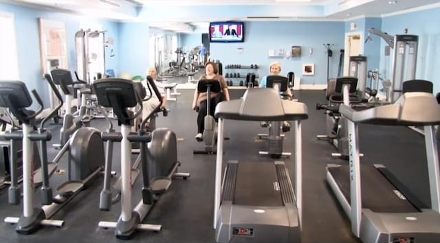 exercise room featuring ornamental molding