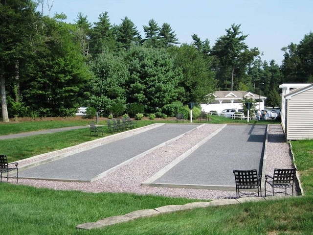 view of home's community with a yard