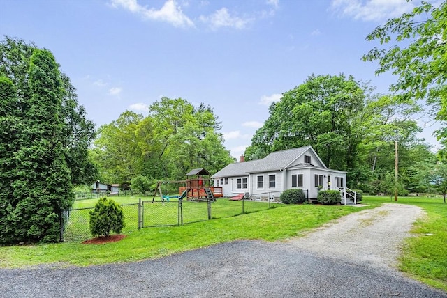 38 Main St, Acton, MA 01720 - view of front of home featuring a playground, a gate, a chimney, and gravel driveway
