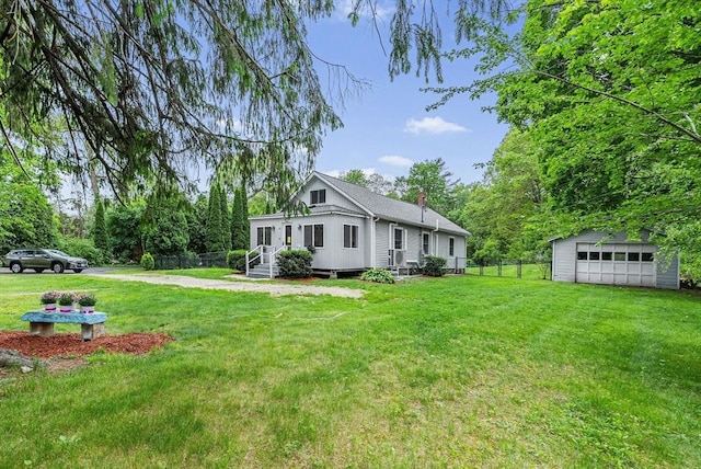 38 Main St, Acton, MA 01720 - view of home's exterior featuring a detached garage, an outdoor structure, a chimney, and entry steps