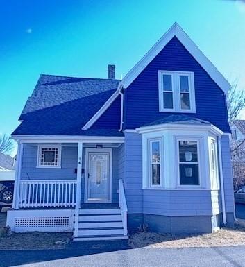 view of front of property featuring a porch and a chimney