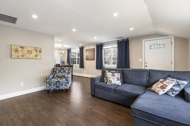 living room with visible vents, recessed lighting, baseboards, and wood finished floors