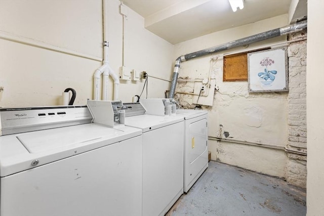 laundry area with independent washer and dryer