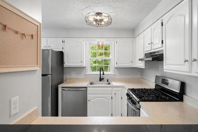 2 Colonial Dr Unit 2, Norton, MA 02766 - kitchen featuring appliances with stainless steel finishes, under cabinet range hood, a textured ceiling, white cabinetry, and light countertops