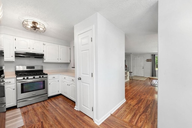 2 Colonial Dr Unit 2, Norton, MA 02766 - kitchen featuring gas range, under cabinet range hood, a textured ceiling, white cabinets, and light countertops