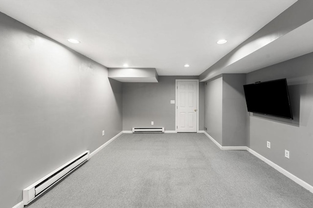 2 Colonial Dr Unit 2, Norton, MA 02766 - finished below grade area featuring a baseboard radiator, recessed lighting, and carpet flooring