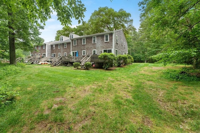 2 Colonial Dr Unit 2, Norton, MA 02766 - rear view of house featuring a yard and a deck