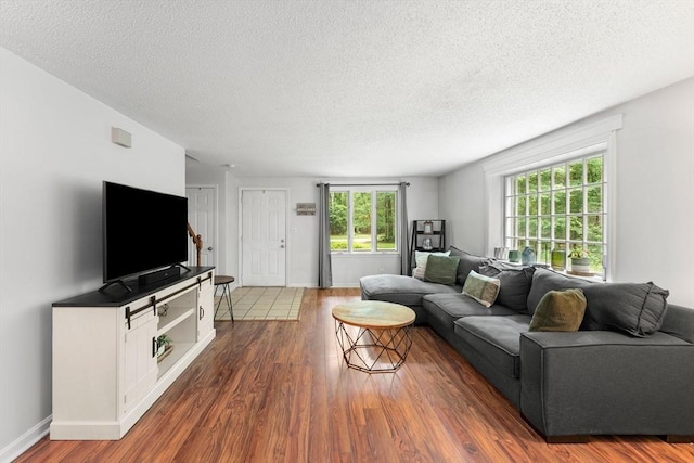 2 Colonial Dr Unit 2, Norton, MA 02766 - living room featuring wood finished floors and a textured ceiling