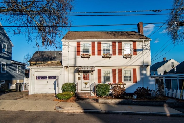 colonial home featuring a garage