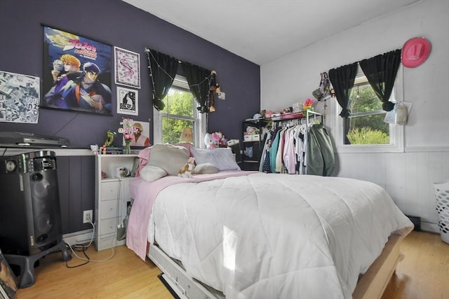 619 Crescent St, Brockton, MA 02302 - bedroom with wood finished floors and a wainscoted wall