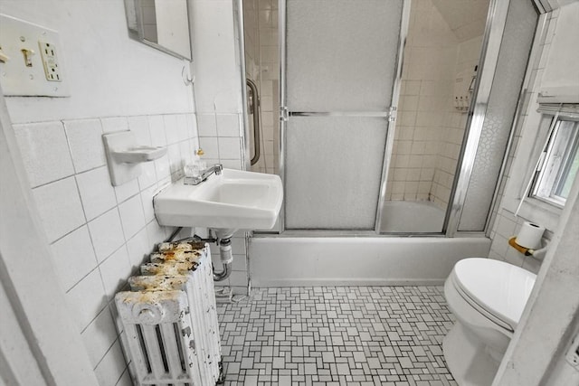 619 Crescent St, Brockton, MA 02302 - full bath featuring tile walls, radiator, and enclosed tub / shower combo