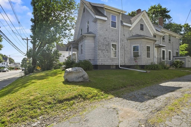 619 Crescent St, Brockton, MA 02302 - view of property exterior with a chimney, a yard, and roof with shingles