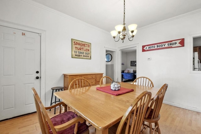 619 Crescent St, Brockton, MA 02302 - dining room featuring light wood-style flooring, a chandelier, and crown molding