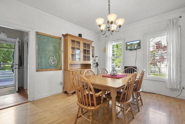 619 Crescent St, Brockton, MA 02302 - dining room with a chandelier, light wood-style flooring, plenty of natural light, and ornamental molding