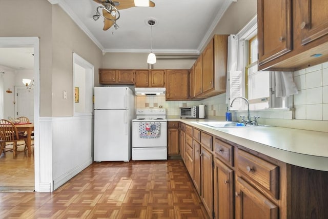 619 Crescent St, Brockton, MA 02302 - kitchen featuring white appliances, under cabinet range hood, ceiling fan, brown cabinets, and crown molding