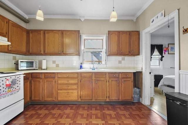 619 Crescent St, Brockton, MA 02302 - kitchen featuring range, brown cabinetry, crown molding, and light countertops