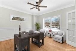 office with ceiling fan, light hardwood / wood-style flooring, and ornamental molding