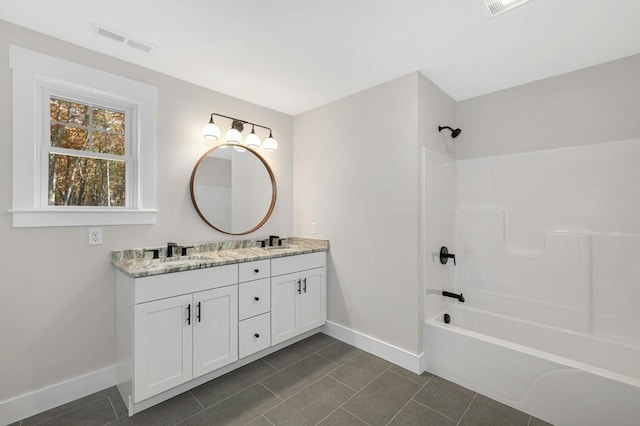 bathroom featuring vanity and shower / tub combination