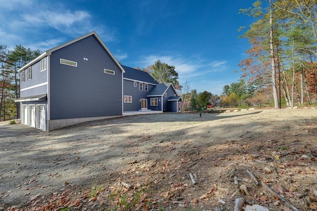 view of side of home with a garage