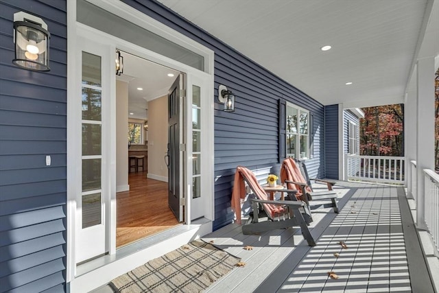 wooden deck featuring covered porch