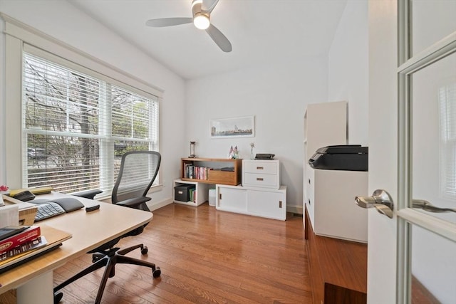home office featuring a ceiling fan and wood finished floors
