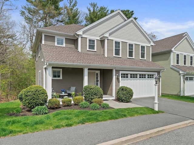 view of front of property with roof with shingles, aphalt driveway, a garage, a porch, and a front yard