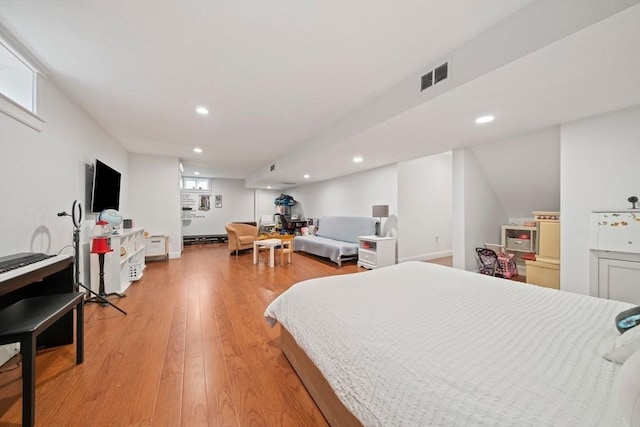 bedroom with recessed lighting, visible vents, and light wood finished floors