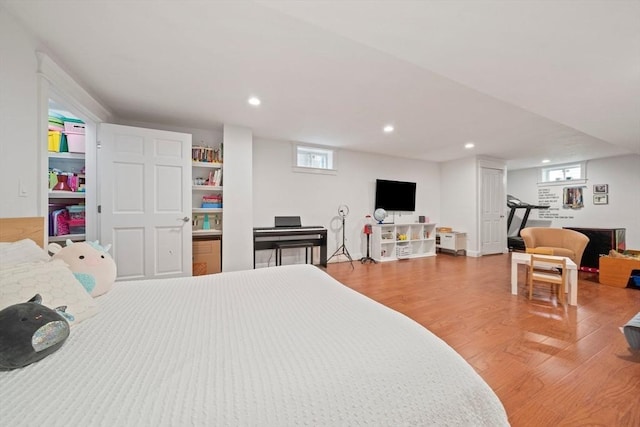 bedroom featuring recessed lighting and wood finished floors