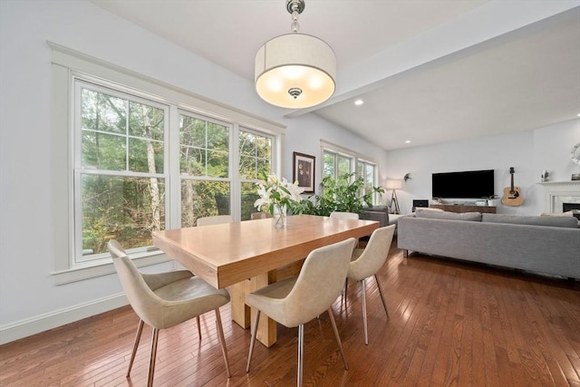 dining room featuring baseboards, recessed lighting, and hardwood / wood-style floors