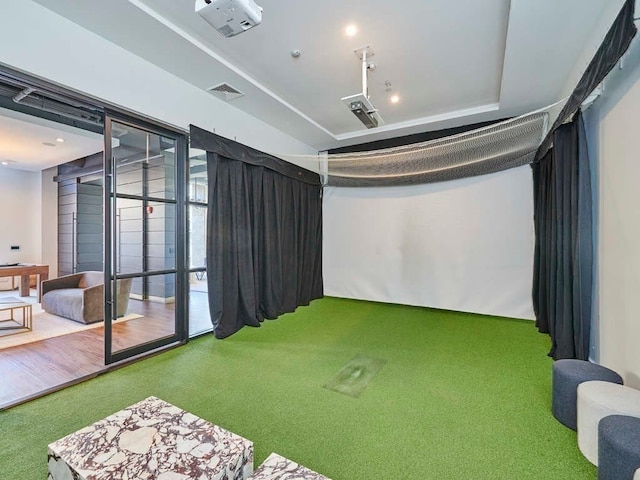 recreation room with golf simulator and carpet floors