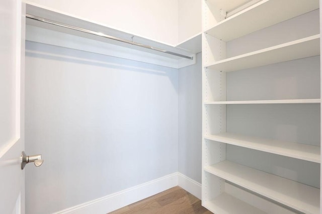 spacious closet with wood finished floors