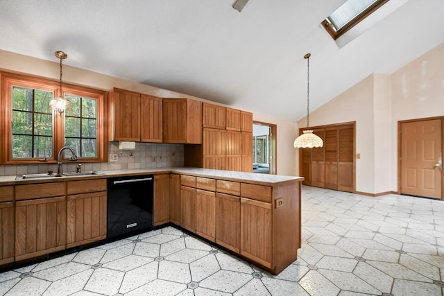 kitchen featuring a skylight, hanging light fixtures, sink, kitchen peninsula, and dishwasher