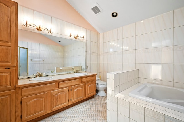 full bathroom with vanity, toilet, shower with separate bathtub, tile walls, and vaulted ceiling