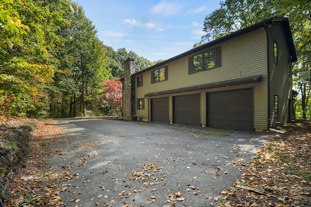 view of property exterior featuring a garage