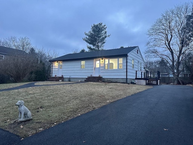 view of side of home with a lawn