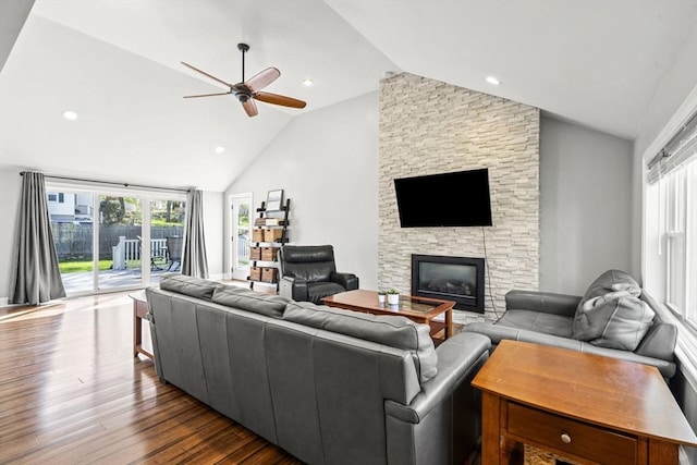 living room with a ceiling fan, dark wood-style flooring, a fireplace, high vaulted ceiling, and recessed lighting