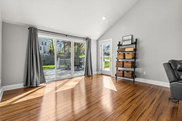 unfurnished room with dark wood-style flooring, baseboards, recessed lighting, and high vaulted ceiling