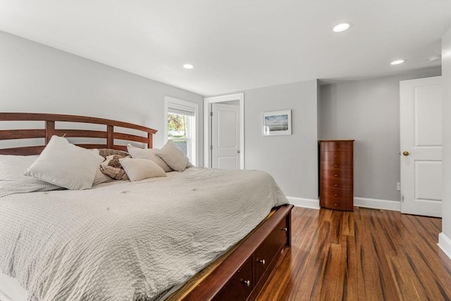 bedroom with baseboards, recessed lighting, and dark wood-type flooring