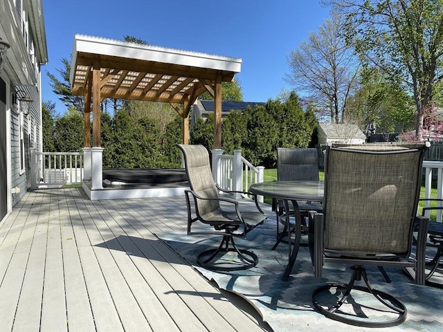 deck featuring a pergola and outdoor dining space