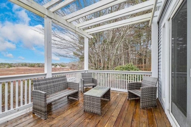 wooden deck with outdoor lounge area and a pergola