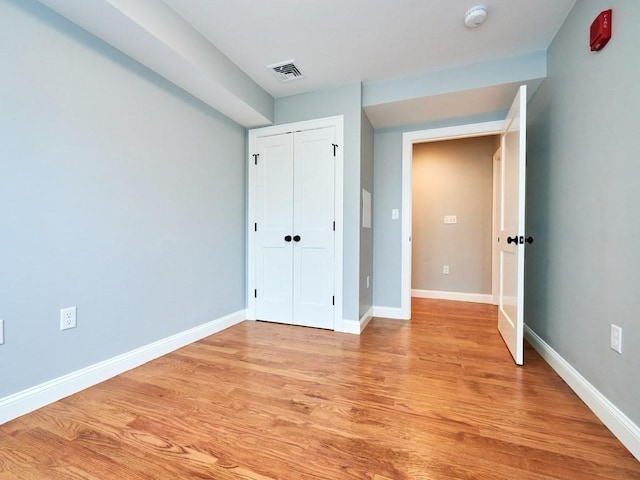 223 Saratoga St Unit U203, Boston, MA 02128 - unfurnished bedroom with light wood-style flooring, baseboards, and a closet