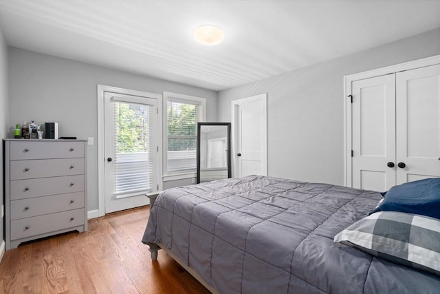 223 Saratoga St Unit U203, Boston, MA 02128 - bedroom with access to exterior, wood finished floors, and a closet