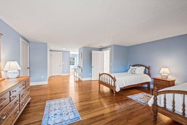 bedroom with wood-type flooring