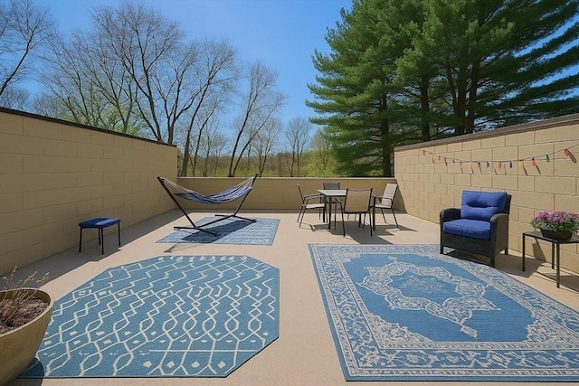 12 Sutton Ct Unit 12, Amherst, MA 01002 - view of patio / terrace featuring fence and outdoor dining space