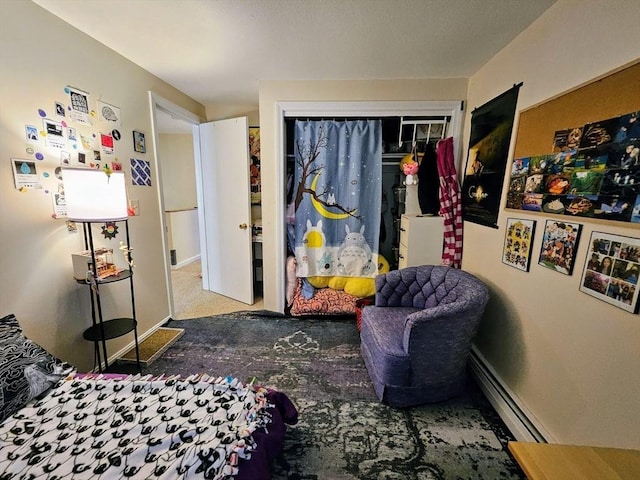 12 Sutton Ct Unit 12, Amherst, MA 01002 - carpeted bedroom featuring a closet and a baseboard radiator