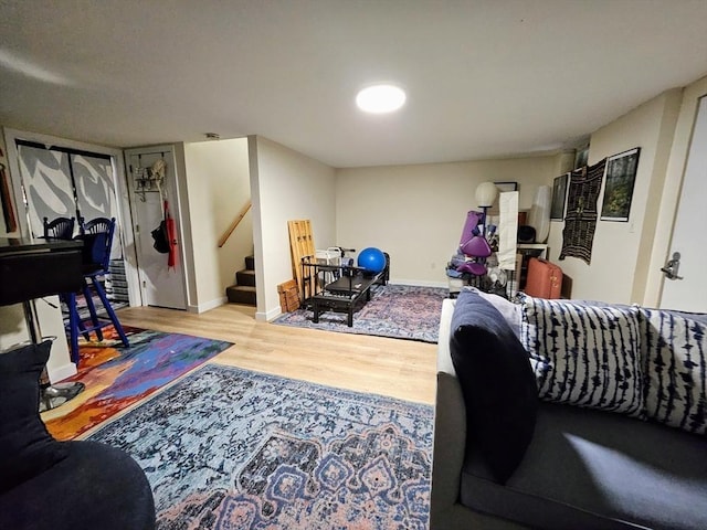 12 Sutton Ct Unit 12, Amherst, MA 01002 - living room featuring wood finished floors, stairs, and baseboards