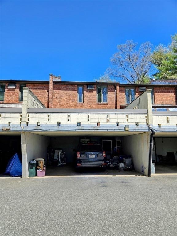 12 Sutton Ct Unit 12, Amherst, MA 01002 - back of house featuring brick siding
